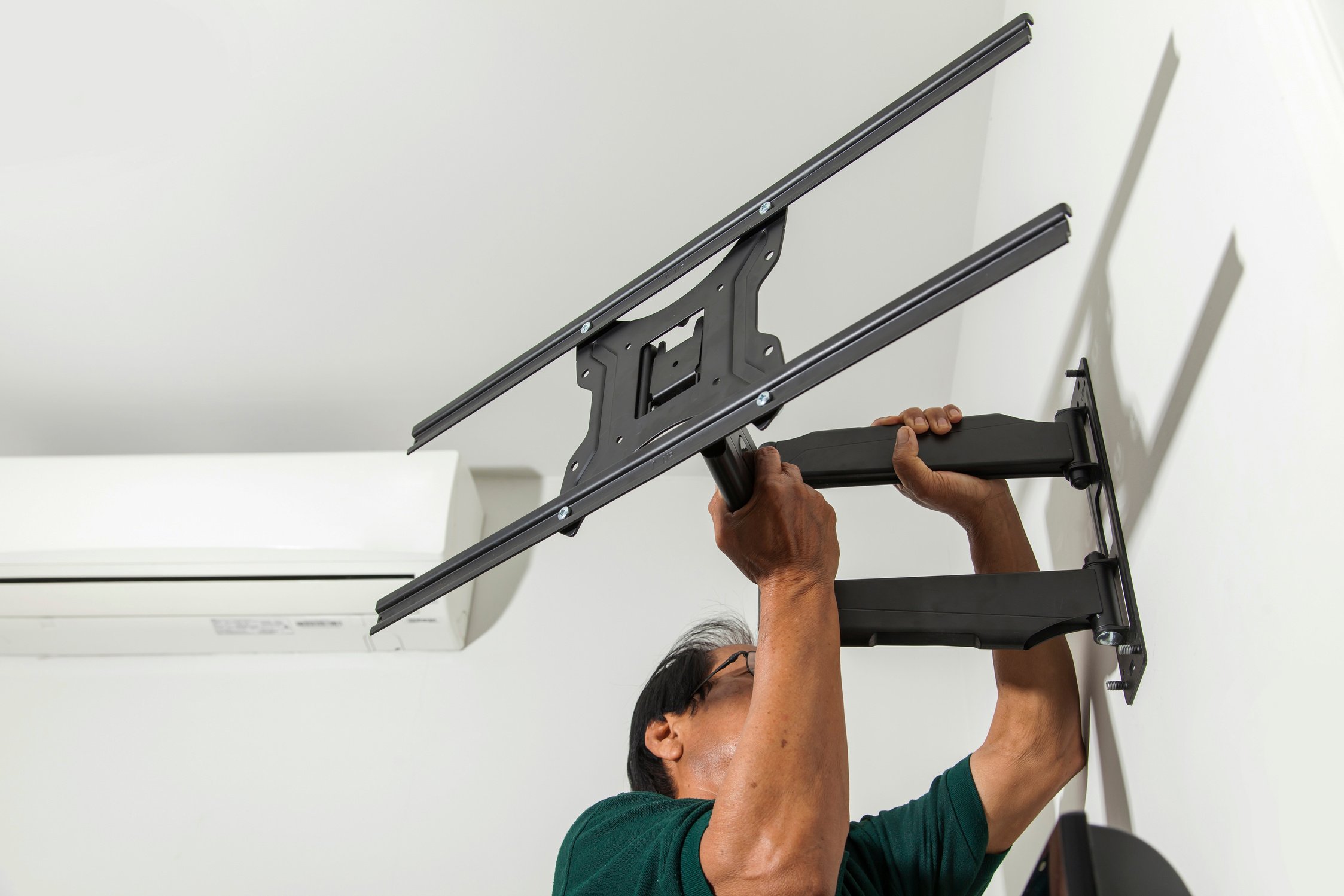 Man Installing Mount TV